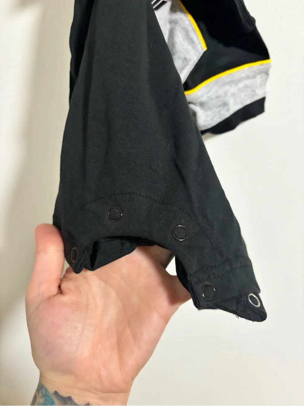 NHL Black One-Piece Romper with Gray Panels and Yellow Piping